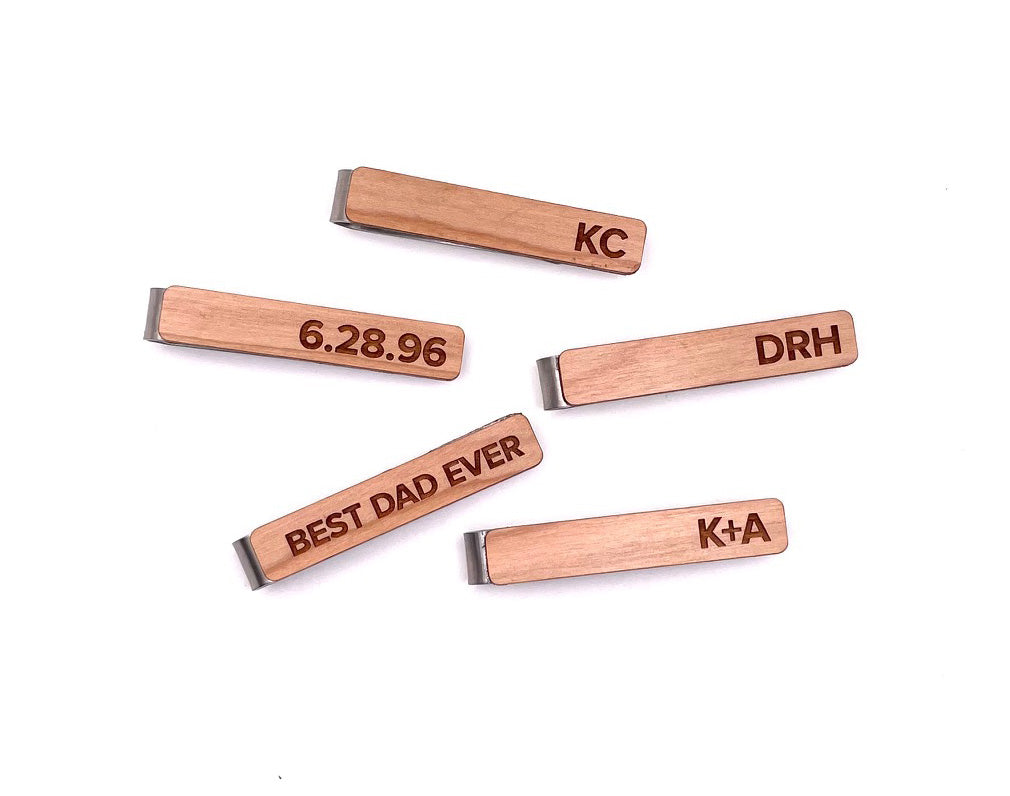 Handcrafted wooden tie clip with personalized engraving, perfect accessory for a stylish and unique look.