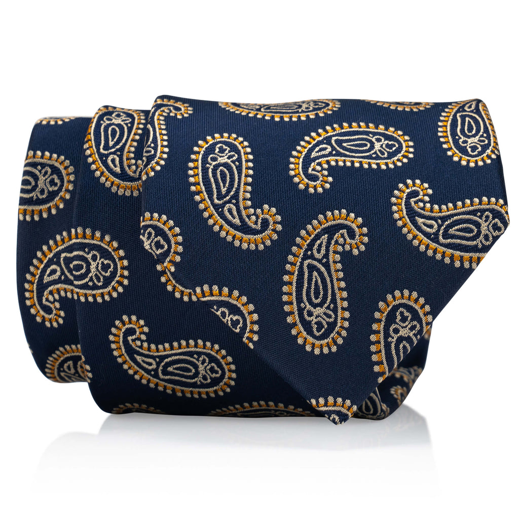 A navy blue tie with a gold paisley design, perfect for adding a touch of elegance to any formal attire.