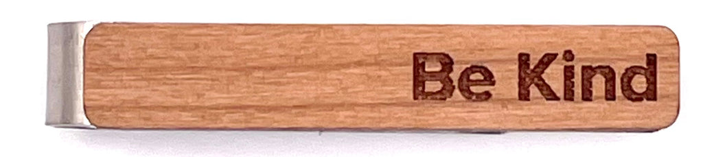 Wooden money clip with 'be kind' engraved on the front, perfect for holding bills and cards in style.