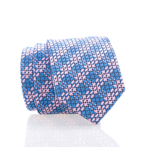 A tie with a geometric pattern in blue and pink colors.